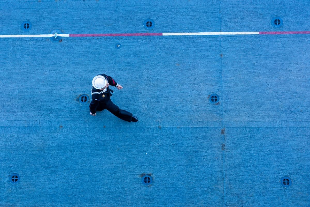 Sailor walking on the deck of a ship