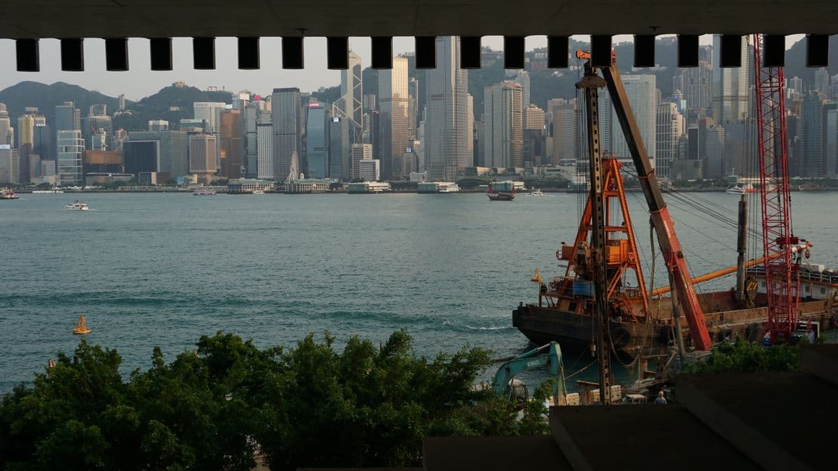 Skyline of a major port city seen from the harbour